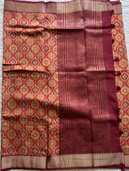 Dola Crepe Saree Dark Peach Colored Complemented with a Maroon Color Zari Border. - Sampradaya Designer Studio