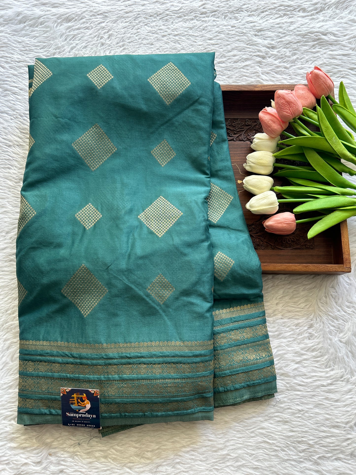 Semi Georgette Saree Pine Green Colored Complemented with a Zari Border. - Sampradaya Designer Studio