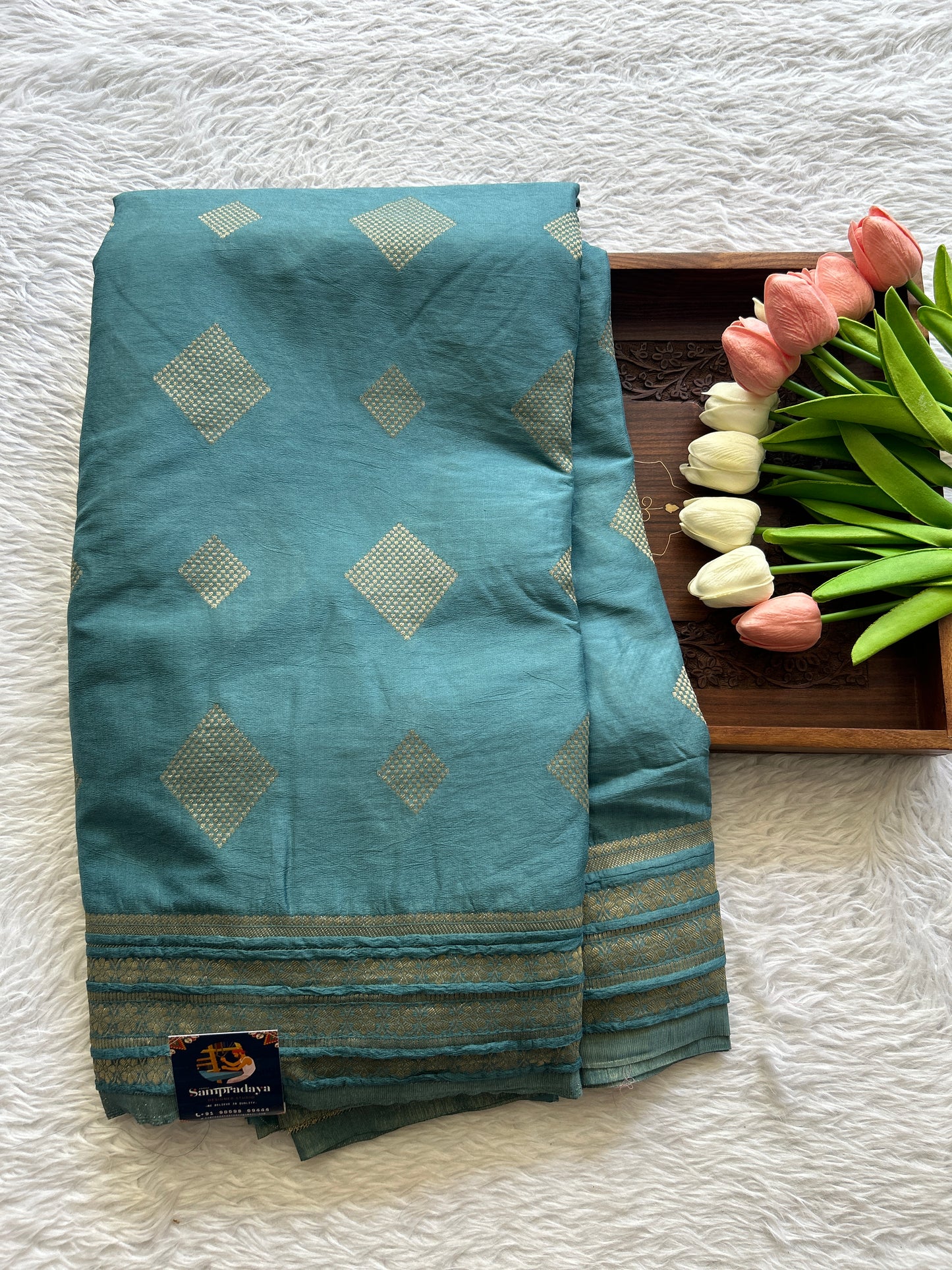 Semi Georgette Saree Teal Blue Colored Complemented with a Zari Border. - Sampradaya Designer Studio