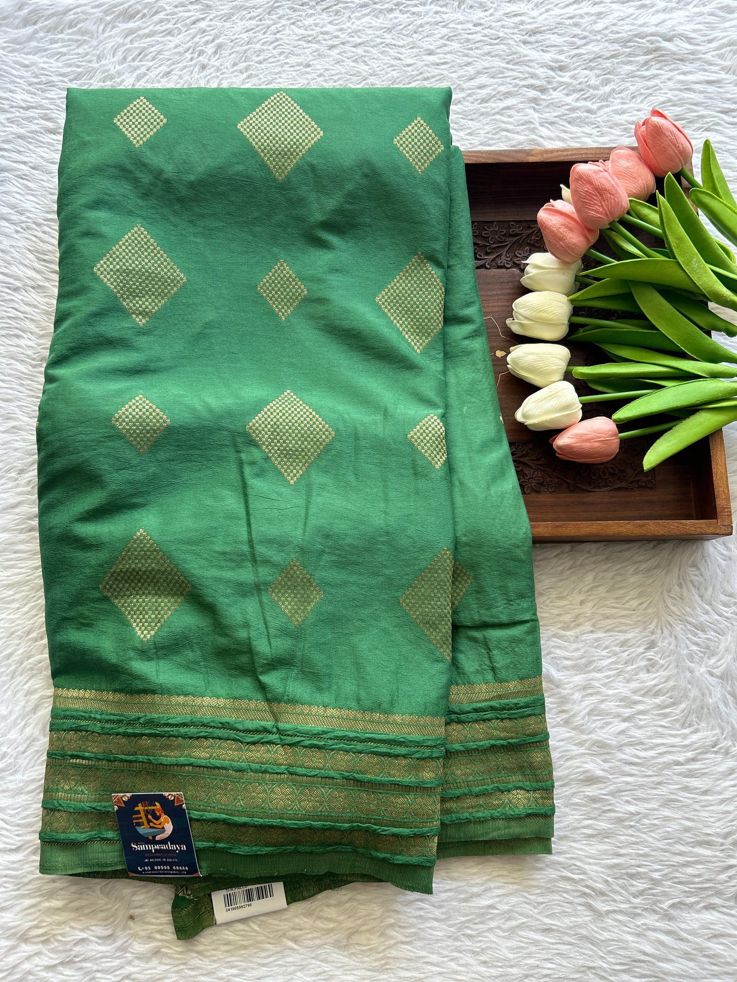 Semi Georgette Saree Green Colored Complemented with a Zari Border. - Sampradaya Designer Studio