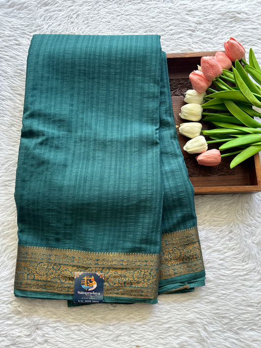 Chiffon Fancy Saree Turquoise Blue Colored Complemented with a Zari Border. - Sampradaya Designer Studio