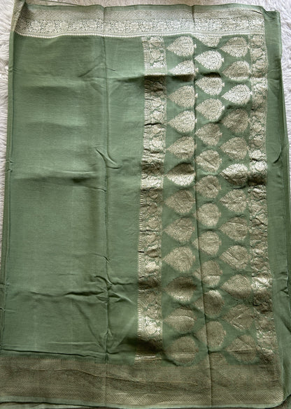 Viscose Georgette Saree Pista Green Colored Complemented with a Zari Border. - Sampradaya Designer Studio