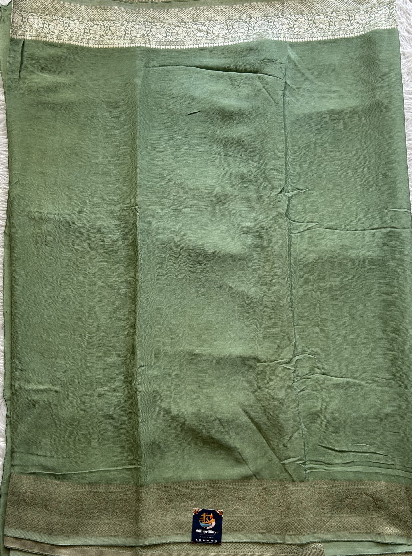 Viscose Georgette Saree Pista Green Colored Complemented with a Zari Border. - Sampradaya Designer Studio