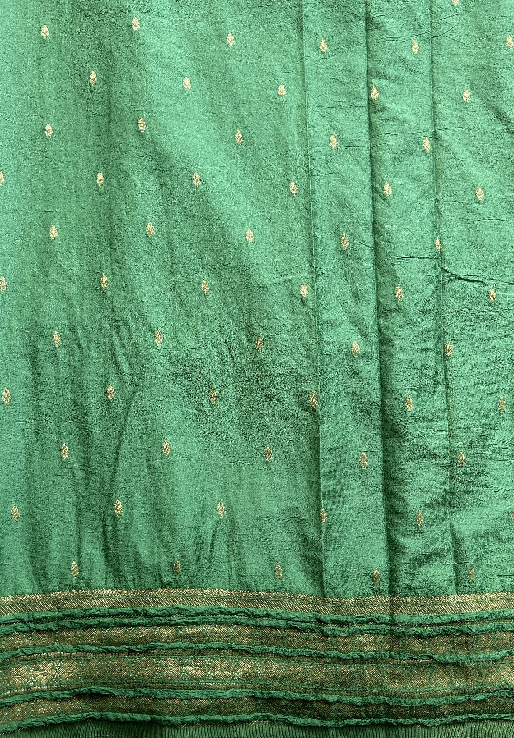 Semi Georgette Saree Green Colored Complemented with a Zari Border. - Sampradaya Designer Studio