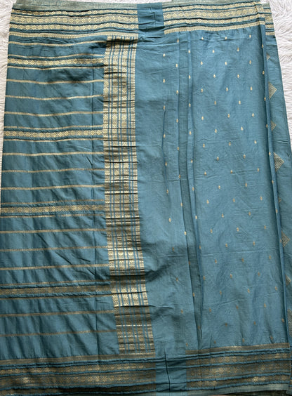 Semi Georgette Saree Teal Blue Colored Complemented with a Zari Border. - Sampradaya Designer Studio