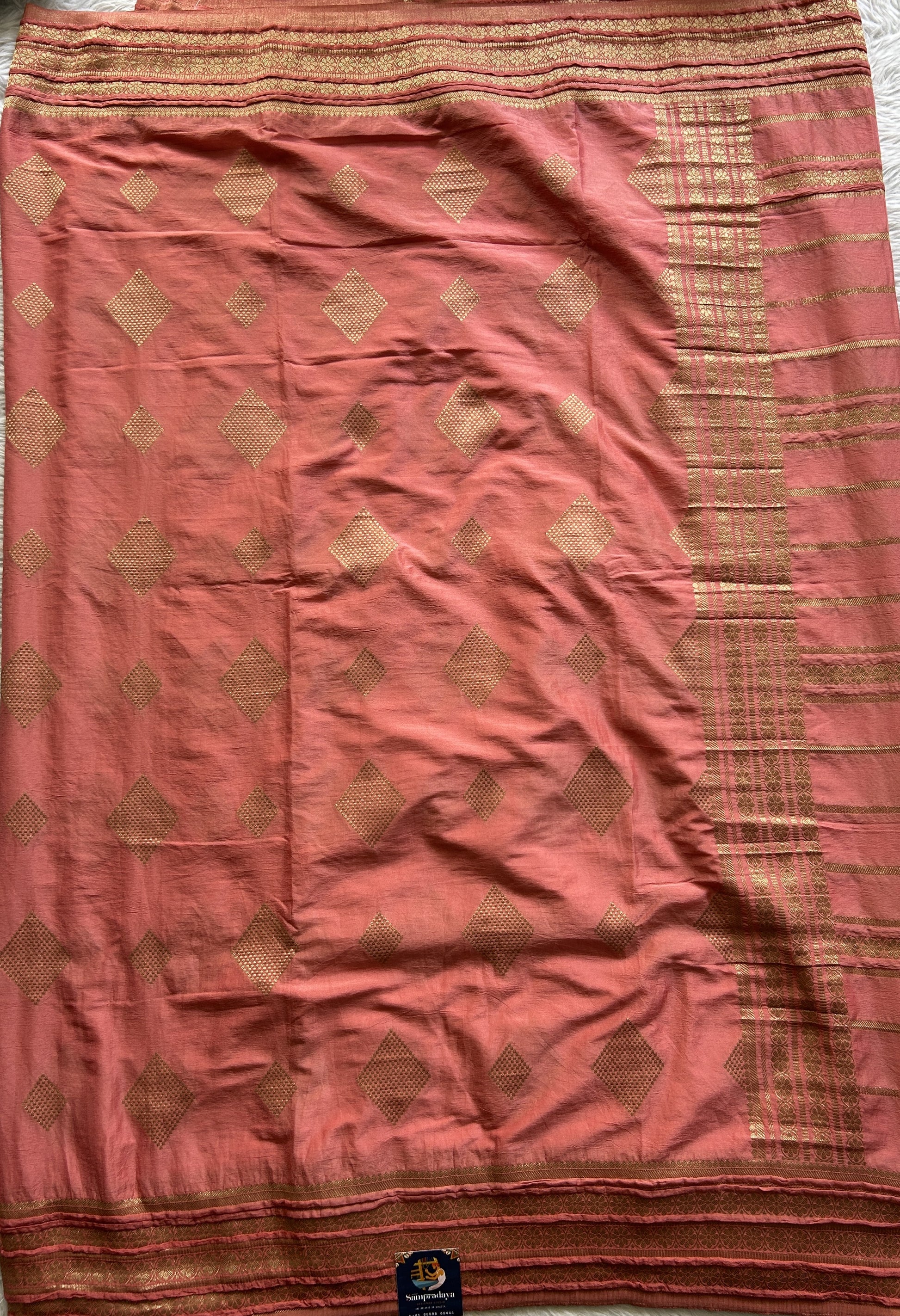 Semi Georgette Saree Dark Peach Colored Complemented with a Zari Border. - Sampradaya Designer Studio