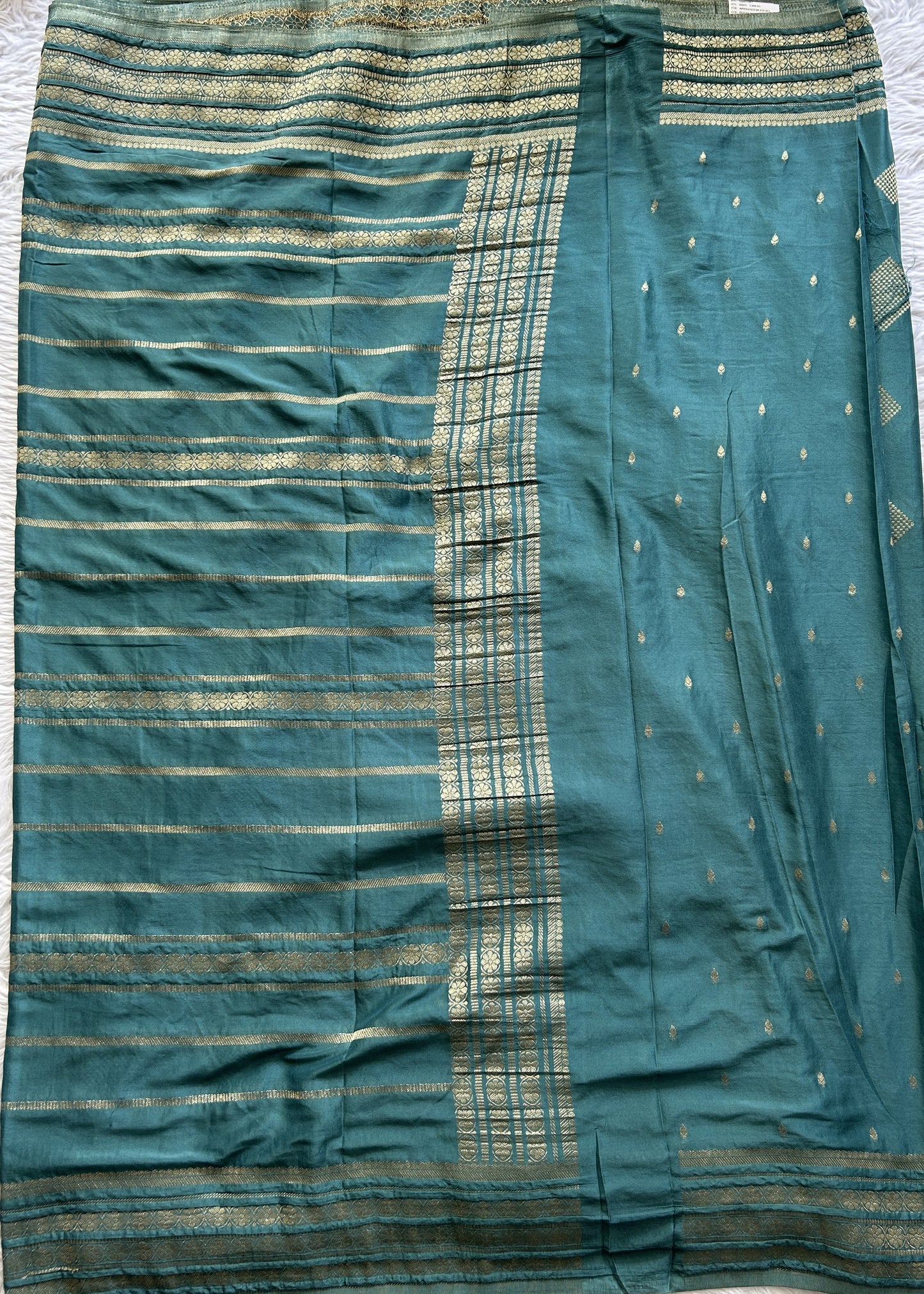 Semi Georgette Saree Pine Green Colored Complemented with a Zari Border. - Sampradaya Designer Studio