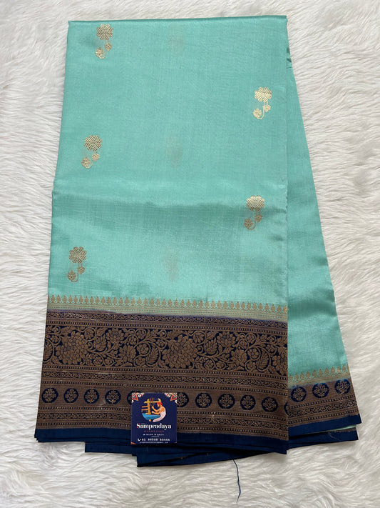 Raw Mango or Pooniya Silk Saree Cyan Colored Complemented With a Navy Blue Gold Zari  Border - Sampradaya Designer Studio