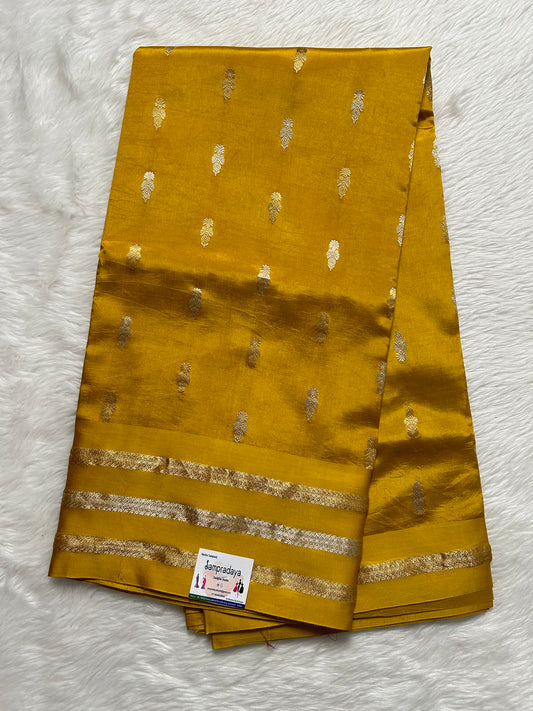 Raw Mango or Pooniya Silk Saree Turmeric Yellow Colored Complemented With a Mashrur Border - Sampradaya Designer Studio