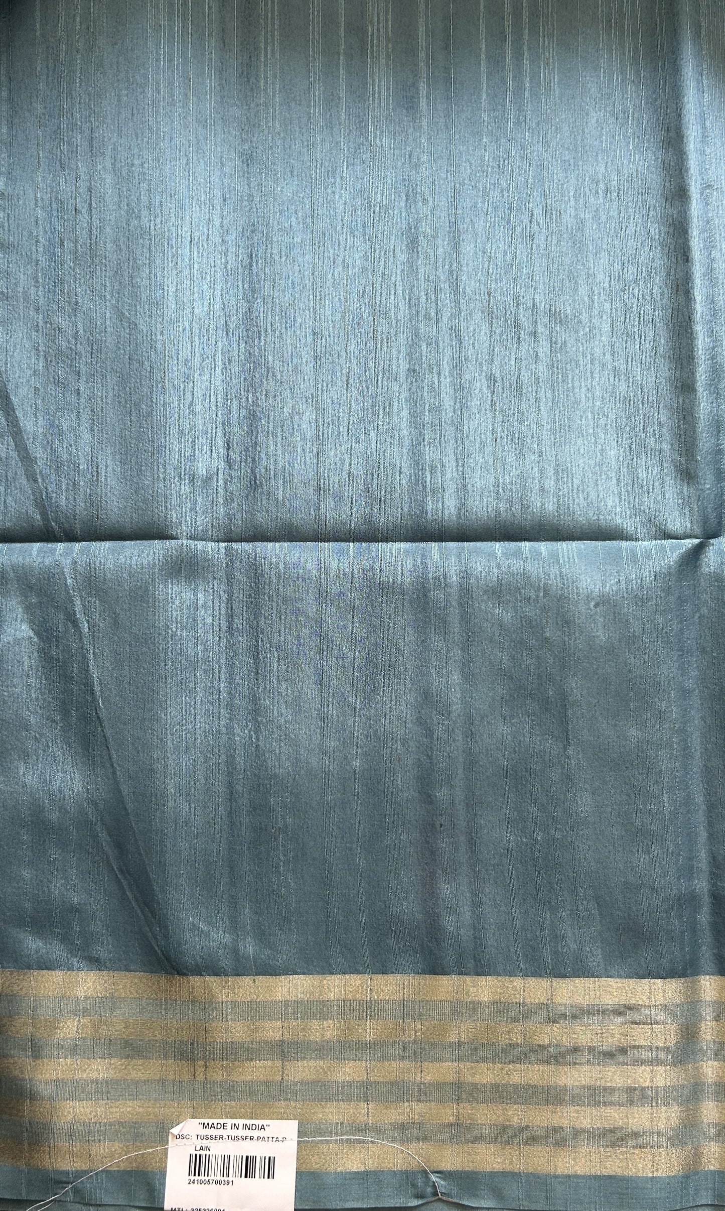 Semi Tussar Saree Gray Colored complemented with a Sea Blue Zari Border. - Sampradaya Designer Studio