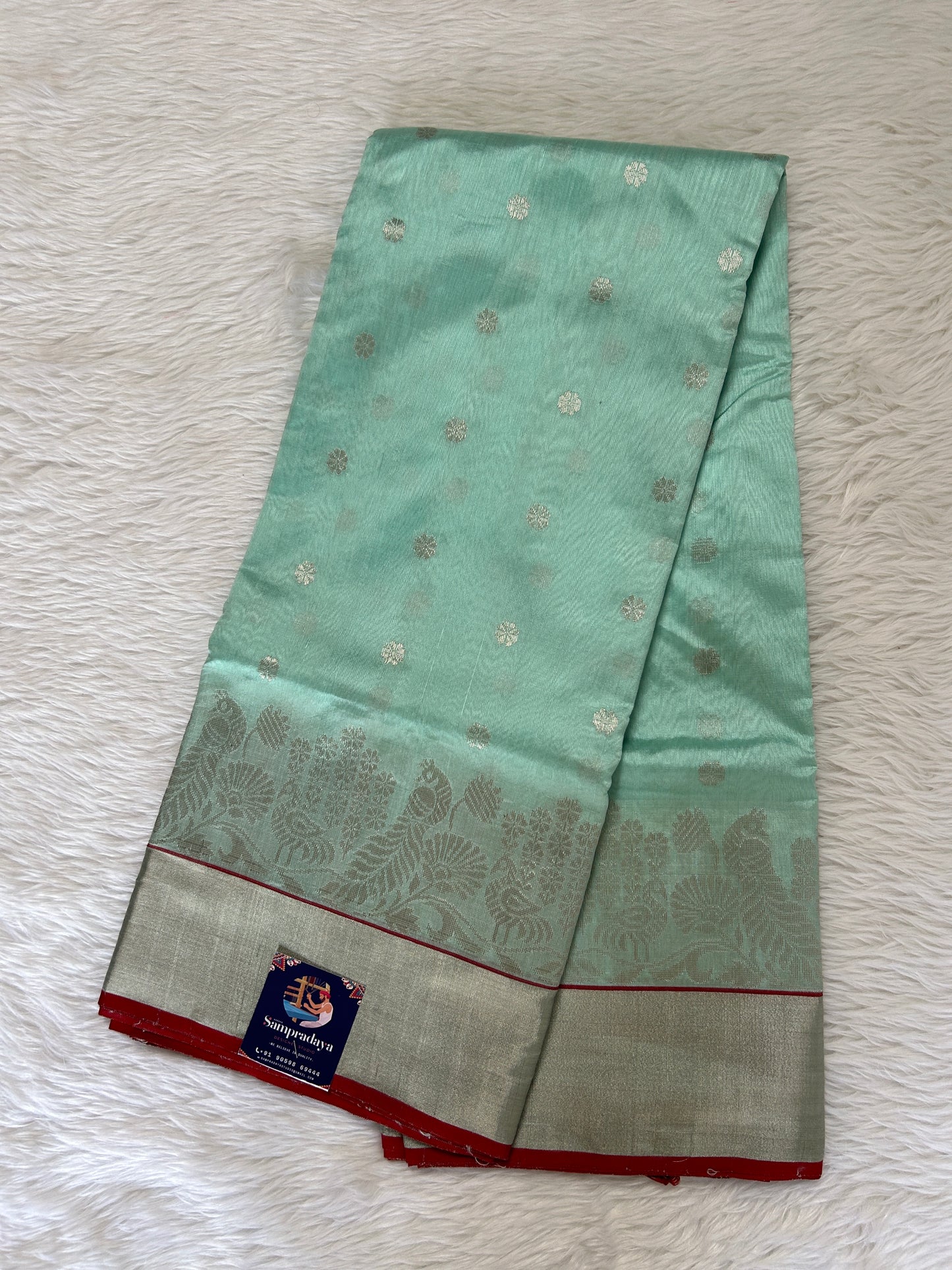 Chanderi Pattu Saree Mint Green colored saree complemented with a Silver Zari border - Sampradaya Designer Studio