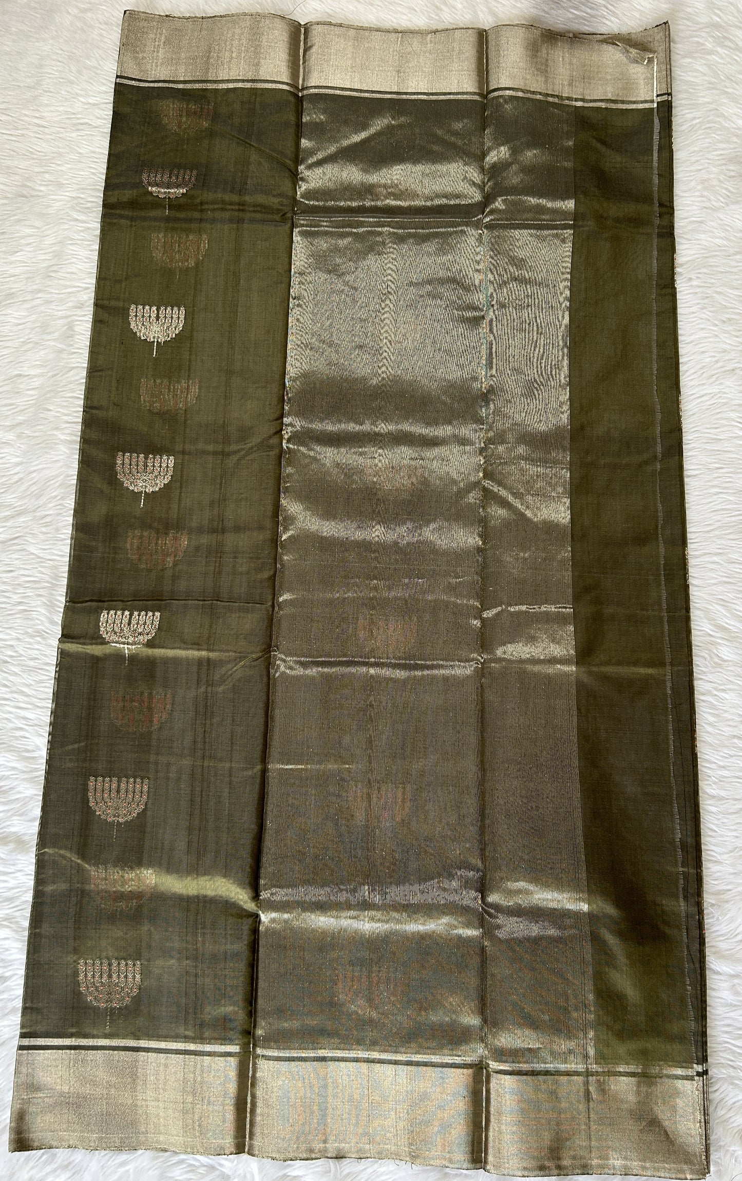 Chanderi Pattu Saree Olive Green colored saree complemented with a Silver Zari border - Sampradaya Designer Studio