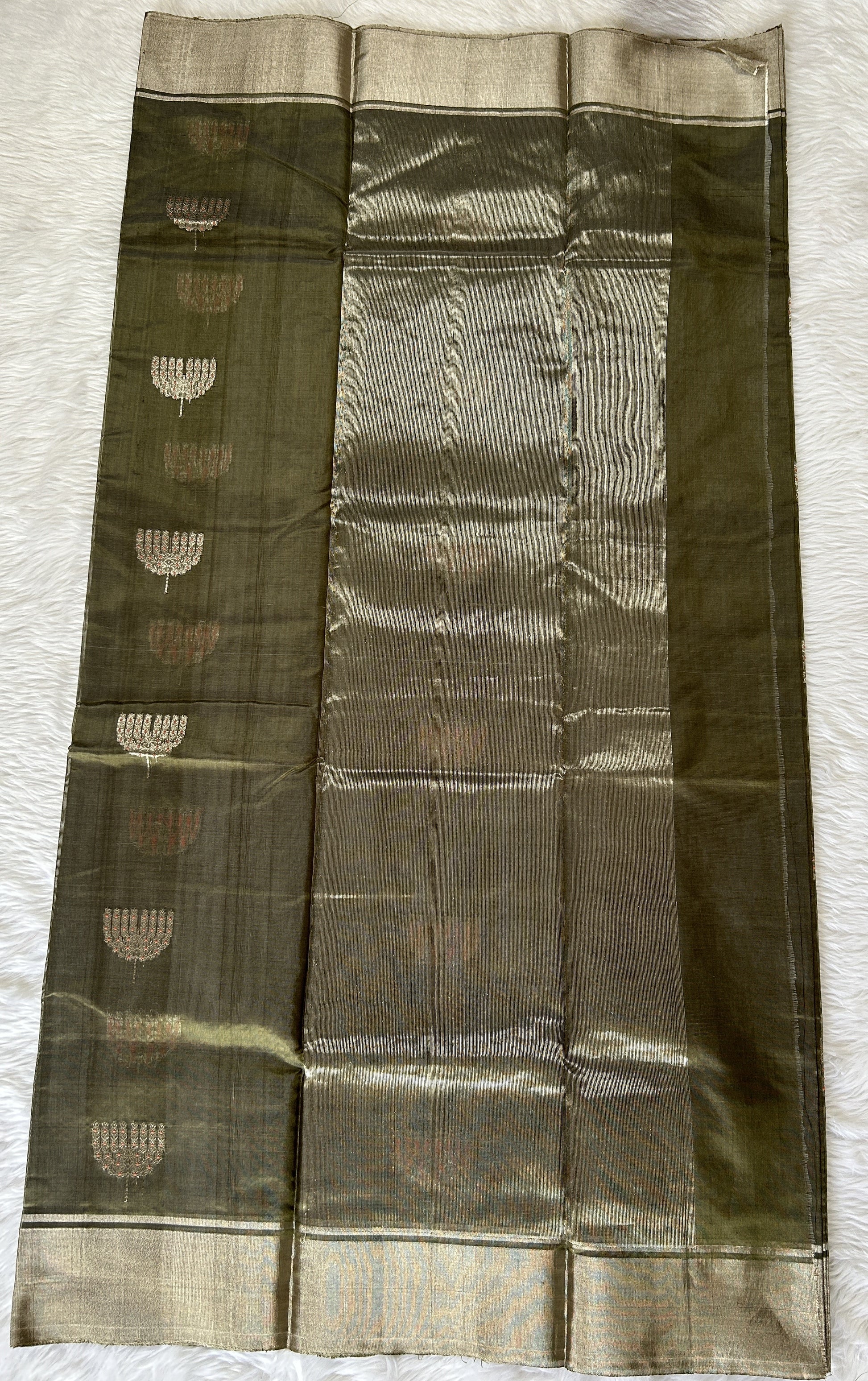 Chanderi Pattu Saree Olive Green colored saree complemented with a Silver Zari border - Sampradaya Designer Studio