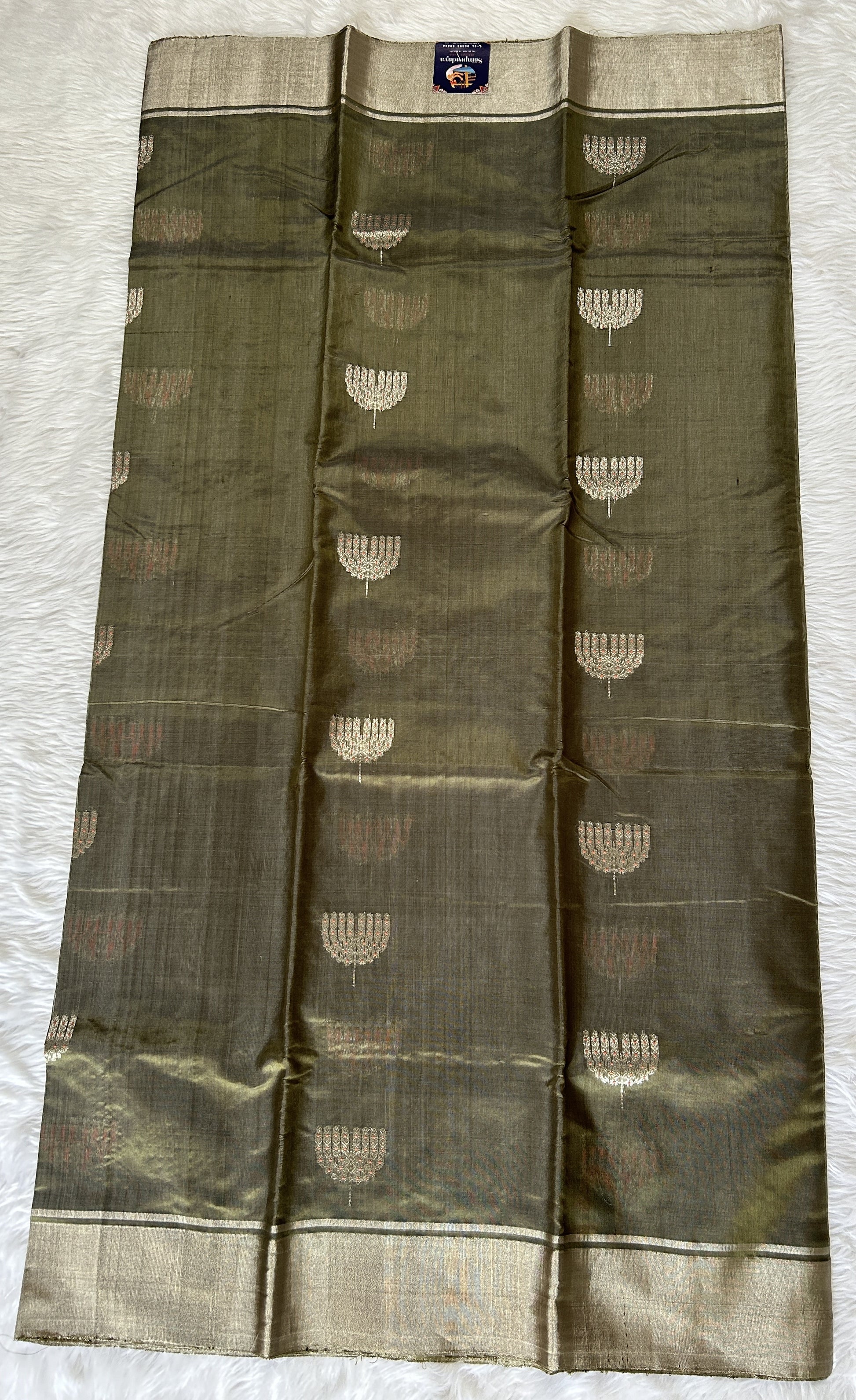 Chanderi Pattu Saree Olive Green colored saree complemented with a Silver Zari border - Sampradaya Designer Studio