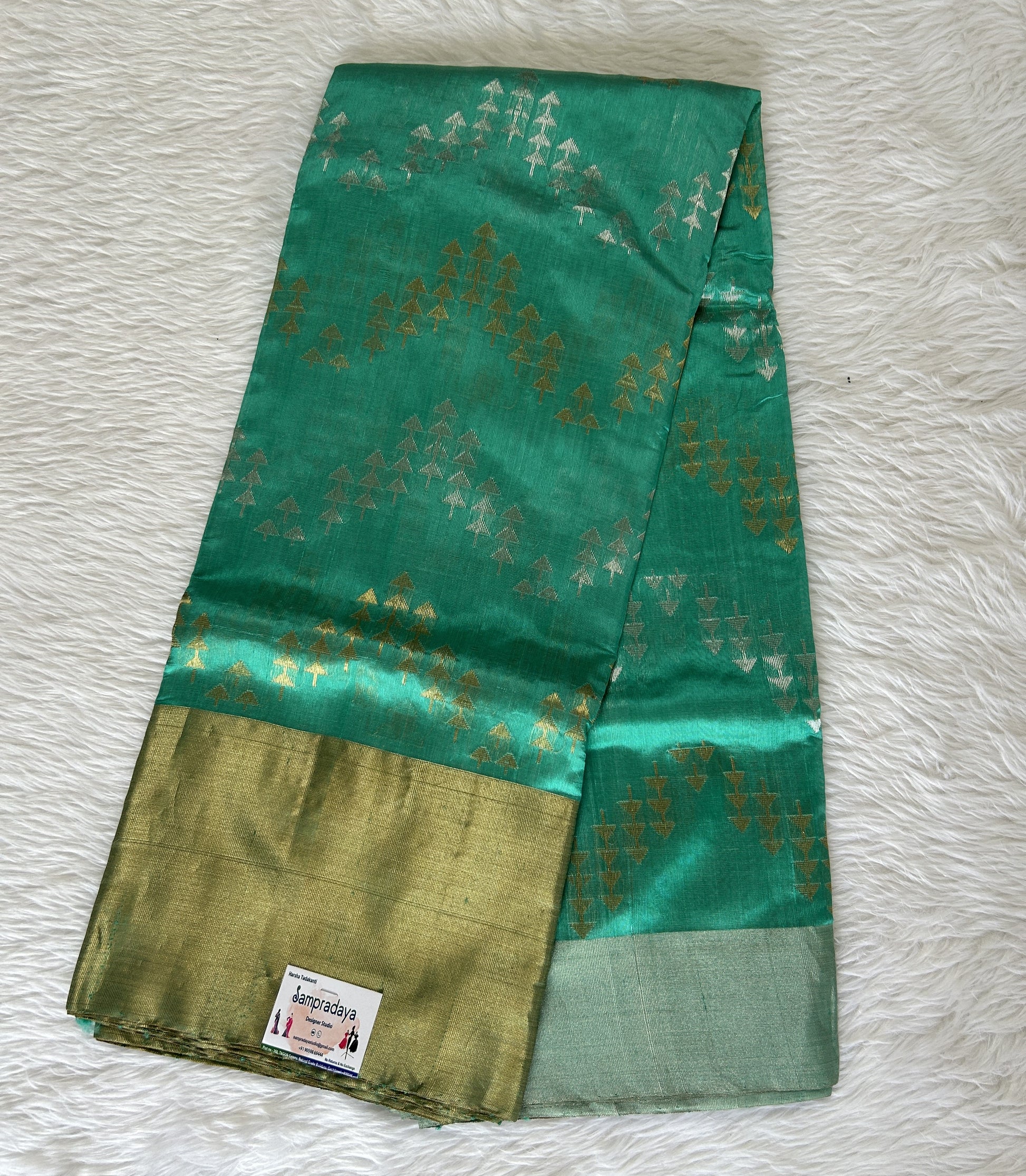 Chanderi Pattu Saree Rama Green colored saree complemented with a Gold & Silver Zari border - Sampradaya Designer Studio