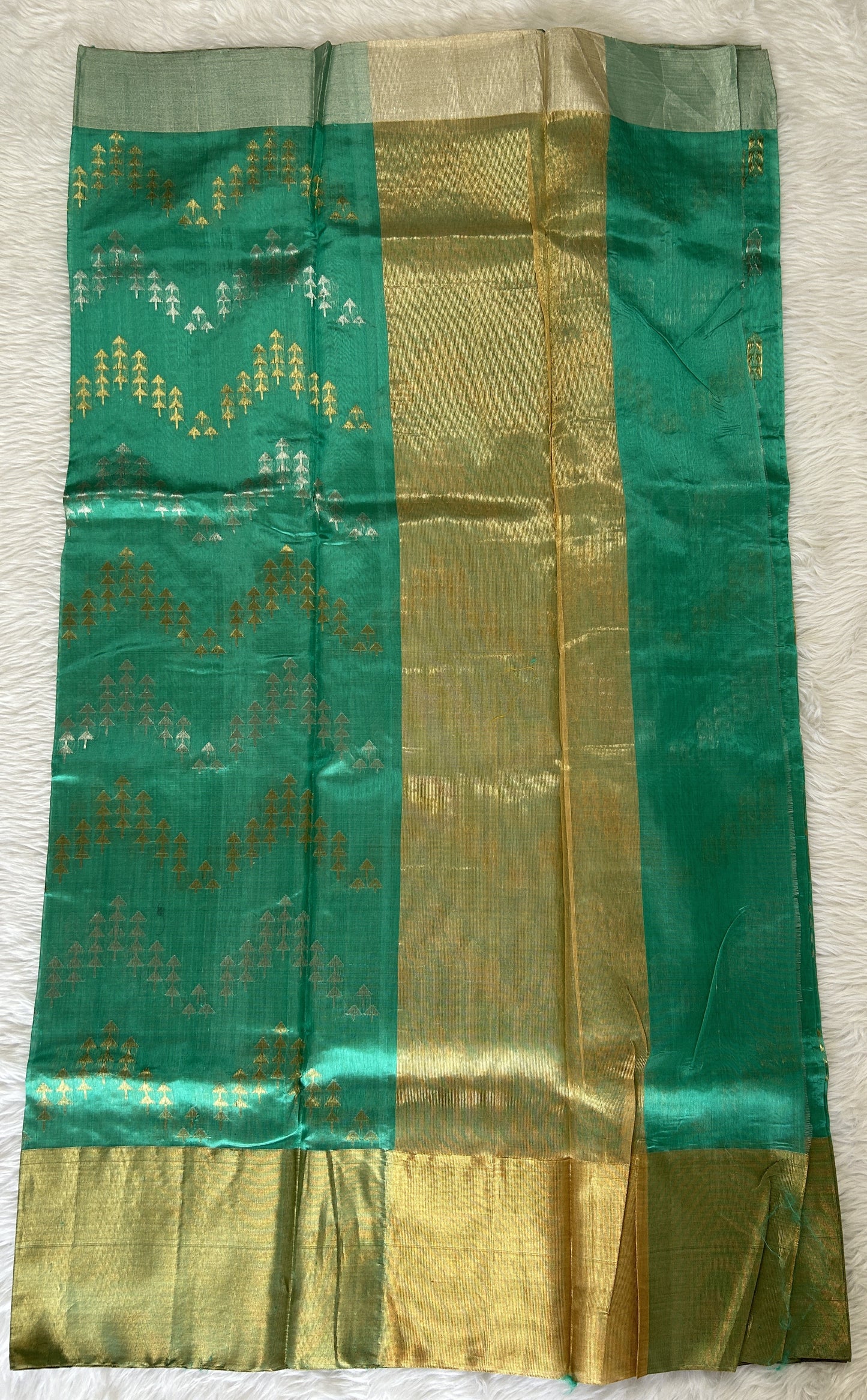 Chanderi Pattu Saree Rama Green colored saree complemented with a Gold & Silver Zari border - Sampradaya Designer Studio