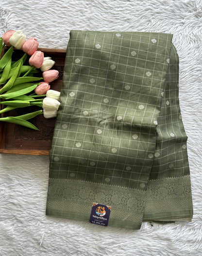 Semi Georgette Saree Olive Green Colored Complemented with a Zari Border. - Sampradaya Designer Studio