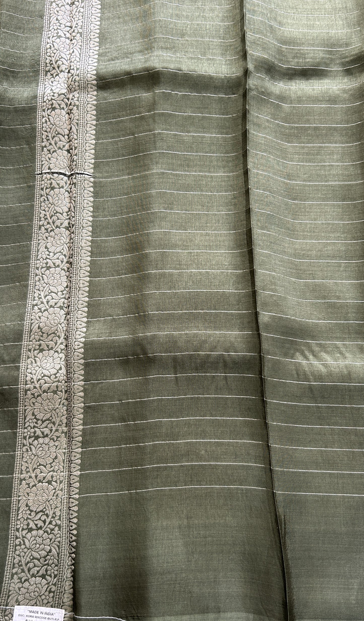 Semi Georgette Saree Olive Green Colored Complemented with a Zari Border. - Sampradaya Designer Studio