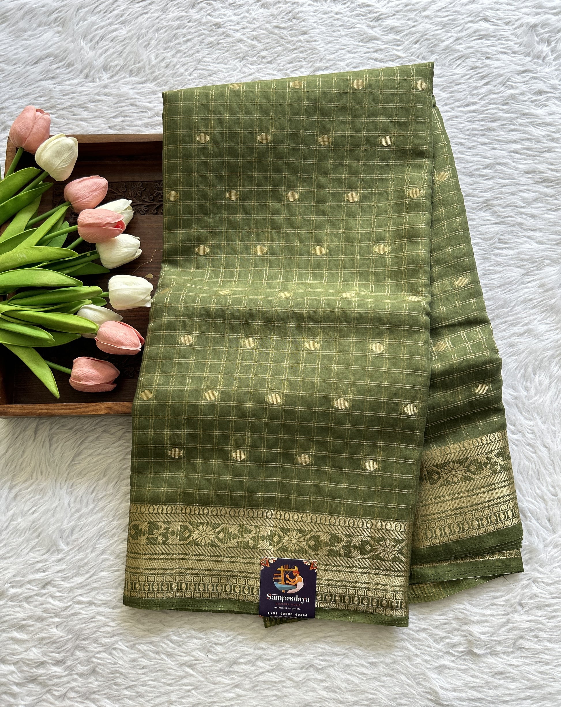 Semi Georgette Saree Olive Green Colored Complemented with a Zari Border. - Sampradaya Designer Studio