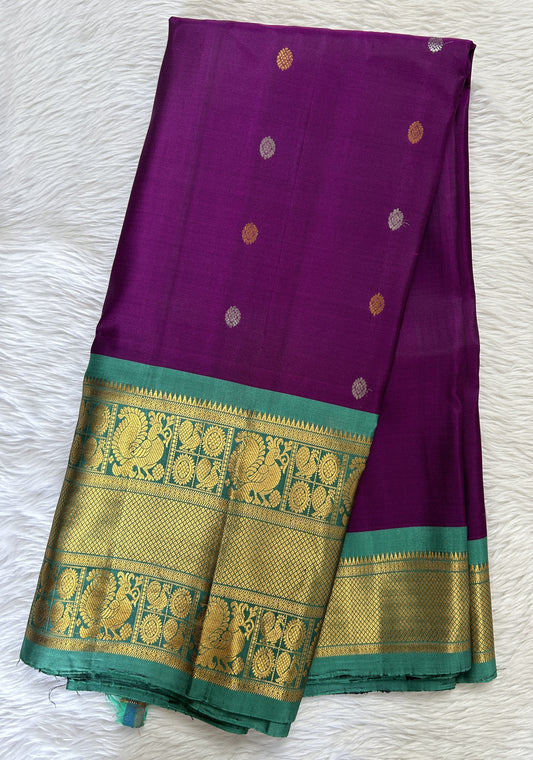 Gadwal Pattu Dark Purple Colored Saree Complemented With a Pattu Emerald Green Color Kanchi Border - Sampradaya Designer Studio