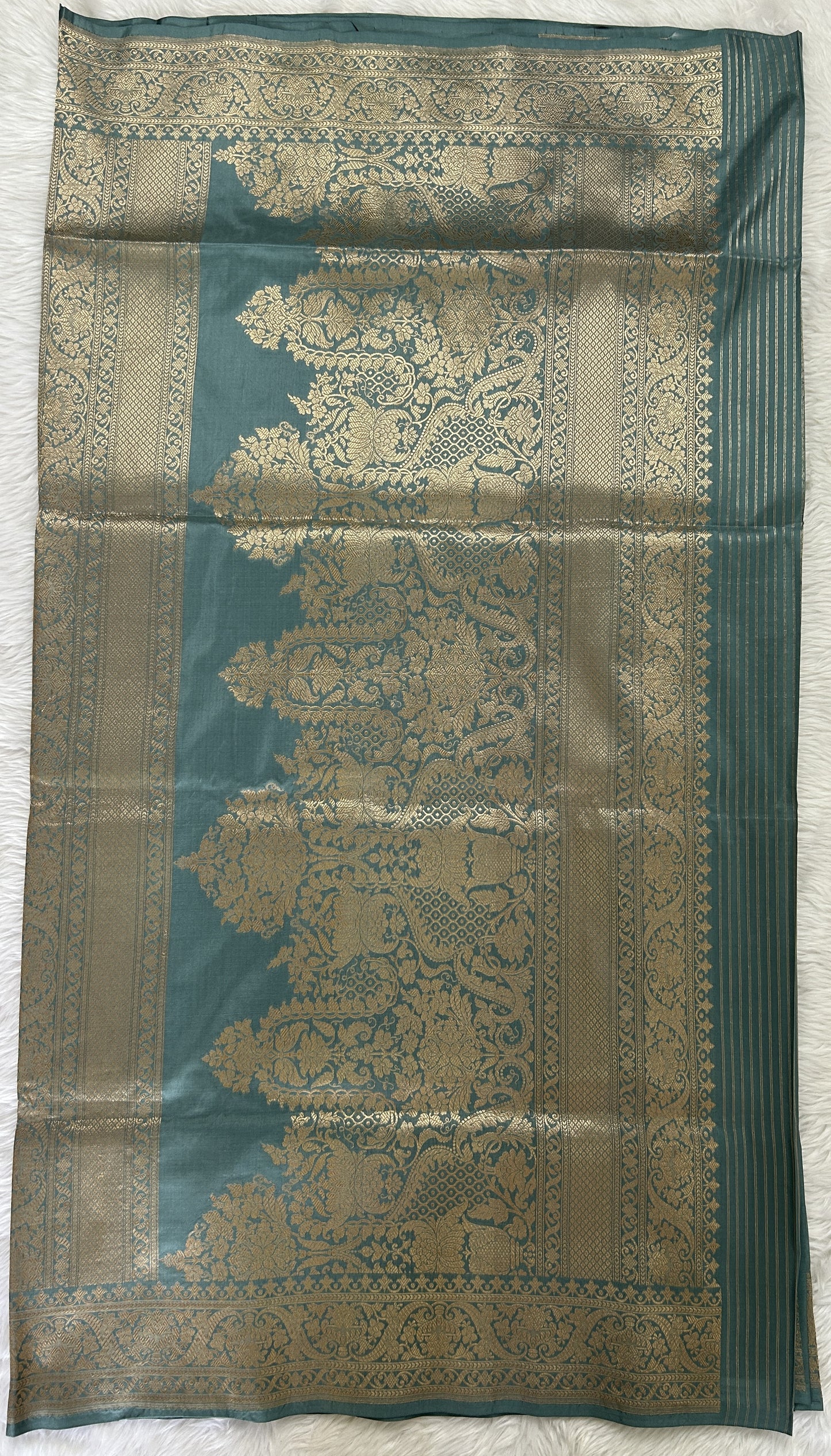 Banarasi Katan Silk Saree Light Teal Blue colored Saree complemented with a Gold Zari border. - Sampradaya Designer Studio