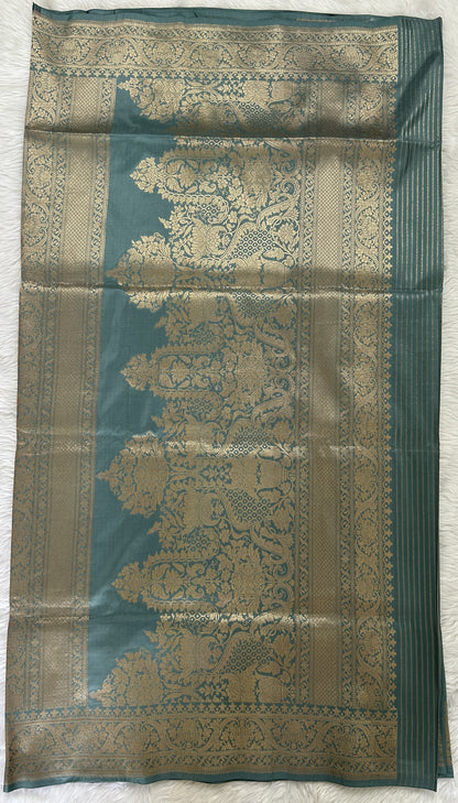 Banarasi Katan Silk Saree Light Teal Blue colored Saree complemented with a Gold Zari border. - Sampradaya Designer Studio