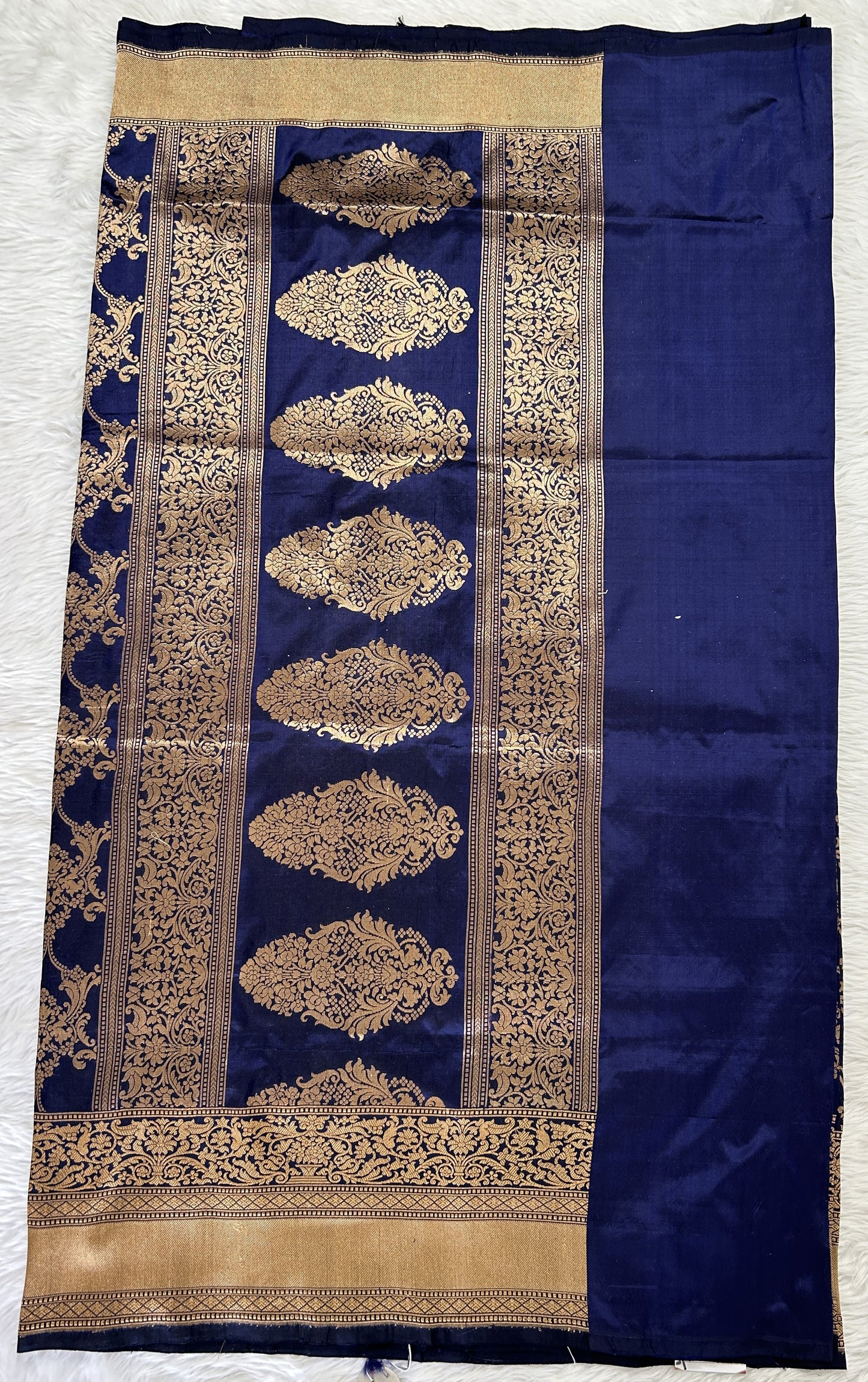 Banarasi Katan Silk Saree Navy Blue colored Saree complemented with a Gold Zari border. - Sampradaya Designer Studio