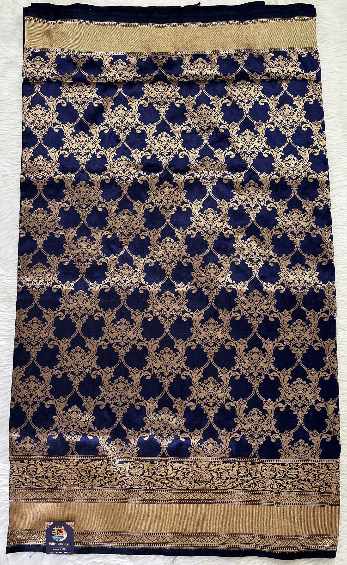 Banarasi Katan Silk Saree Navy Blue colored Saree complemented with a Gold Zari border. - Sampradaya Designer Studio