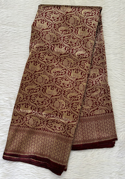 Banarasi Katan Silk Saree Maroon colored Saree complemented with a Gold Zari border. - Sampradaya Designer Studio