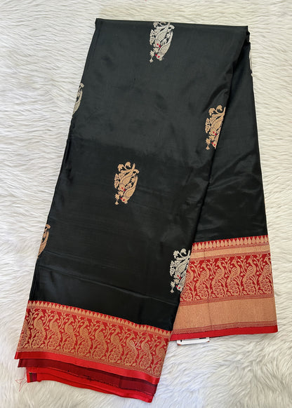 Banarasi Katan Silk Saree Black colored Saree complemented with a Red Colored Zari border. - Sampradaya Designer Studio