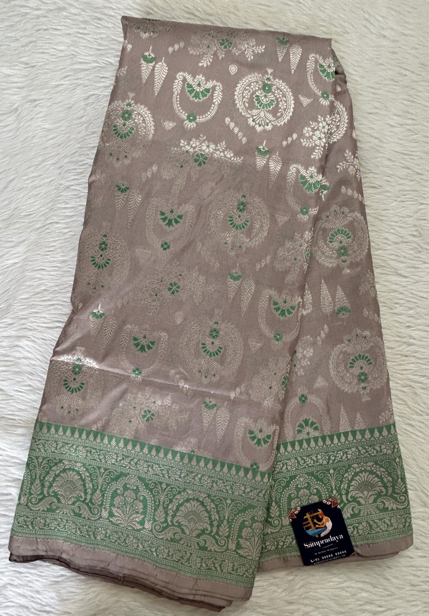 Banarasi Katan Silk Saree Baby Pink colored Saree complemented with a Green Colored Silver Zari border. - Sampradaya Designer Studio