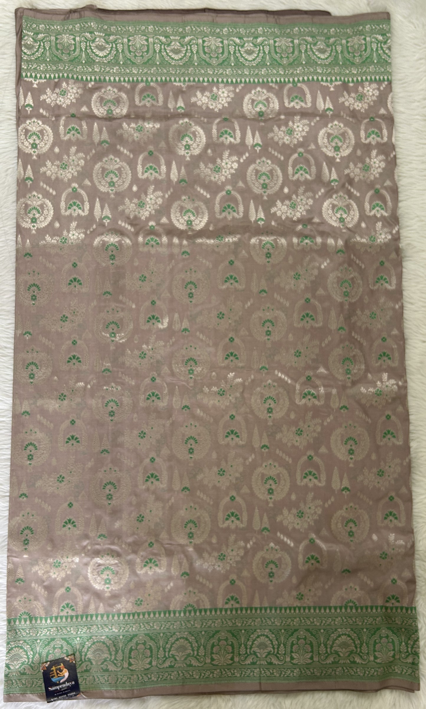 Banarasi Katan Silk Saree Baby Pink colored Saree complemented with a Green Colored Silver Zari border. - Sampradaya Designer Studio