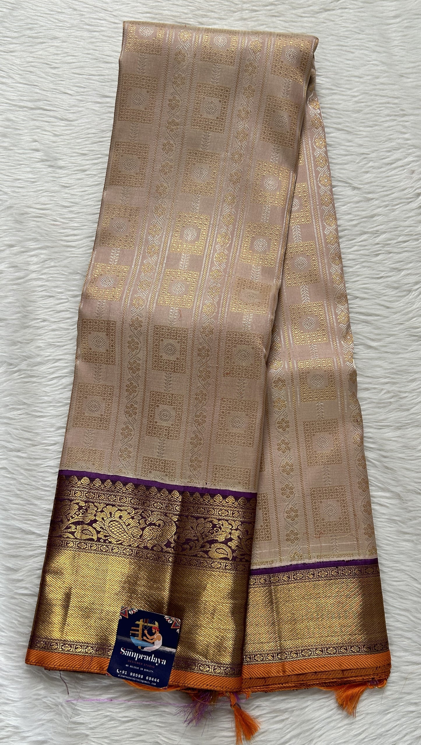 Kanjivaram Bridal Silk Saree Beige colored Saree complemented with a Purple Colored Gold Kanchi border. - Sampradaya Designer Studio