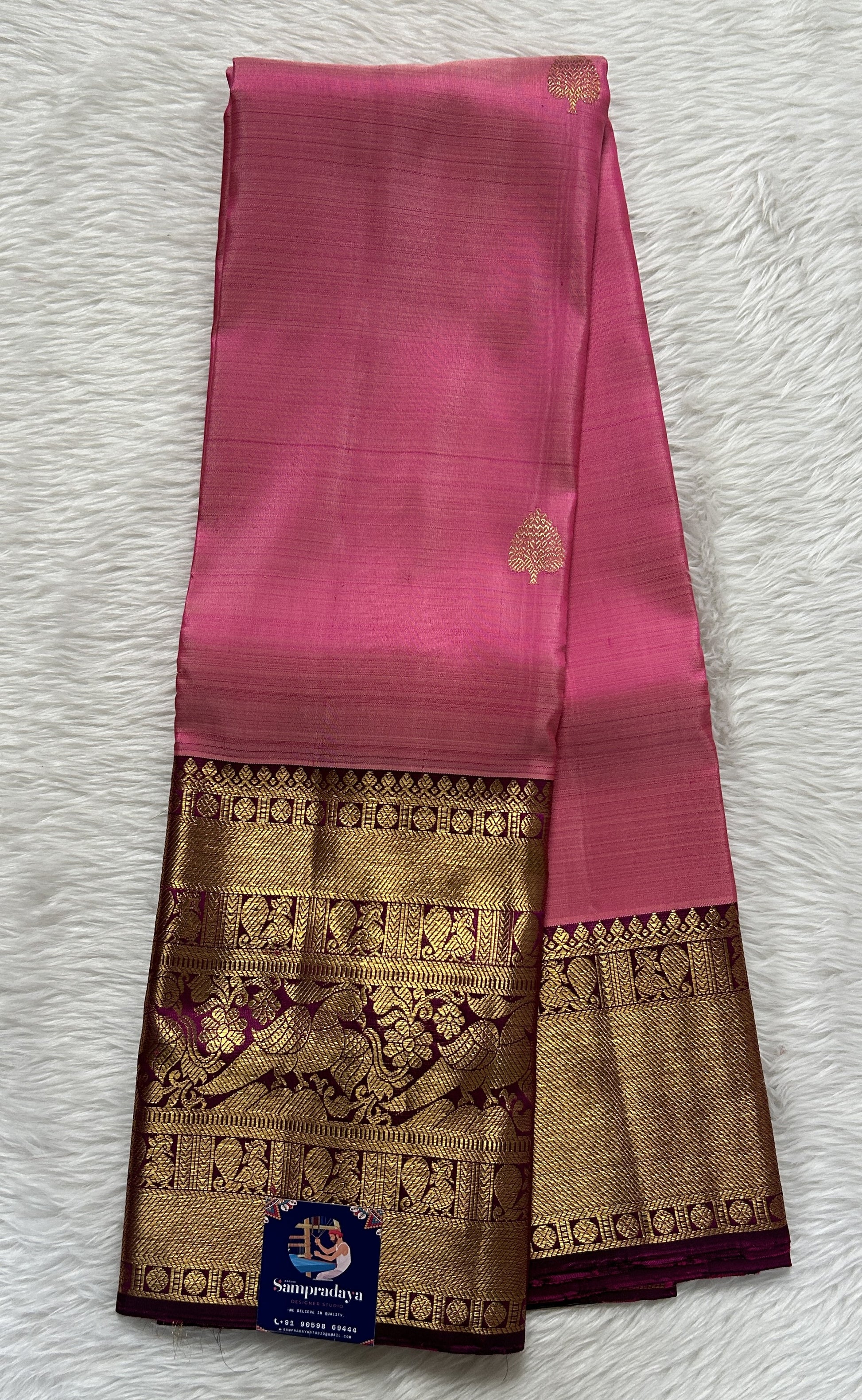 Kanjivaram Festive Silk Saree Pastel Pink colored Saree complemented with a Dark Purple Colored Gold Kanchi border. - Sampradaya Designer Studio