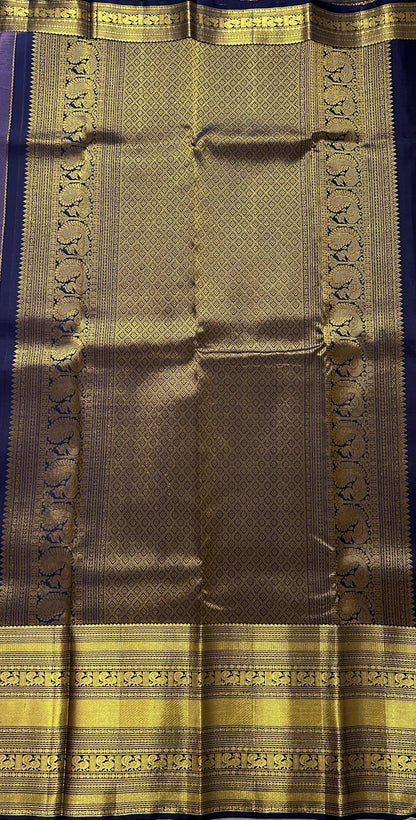 Kanjivaram Festive Silk Saree Lavender colored Saree complemented with a Navy Blue Colored Gold Kanchi border. - Sampradaya Designer Studio