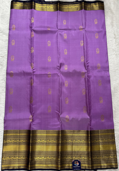 Kanjivaram Festive Silk Saree Lavender colored Saree complemented with a Navy Blue Colored Gold Kanchi border. - Sampradaya Designer Studio