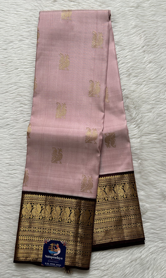 Kanjivaram Festive Silk Saree Pastel Pink colored Saree complemented with a Brown Colored Gold Kanchi border. - Sampradaya Designer Studio