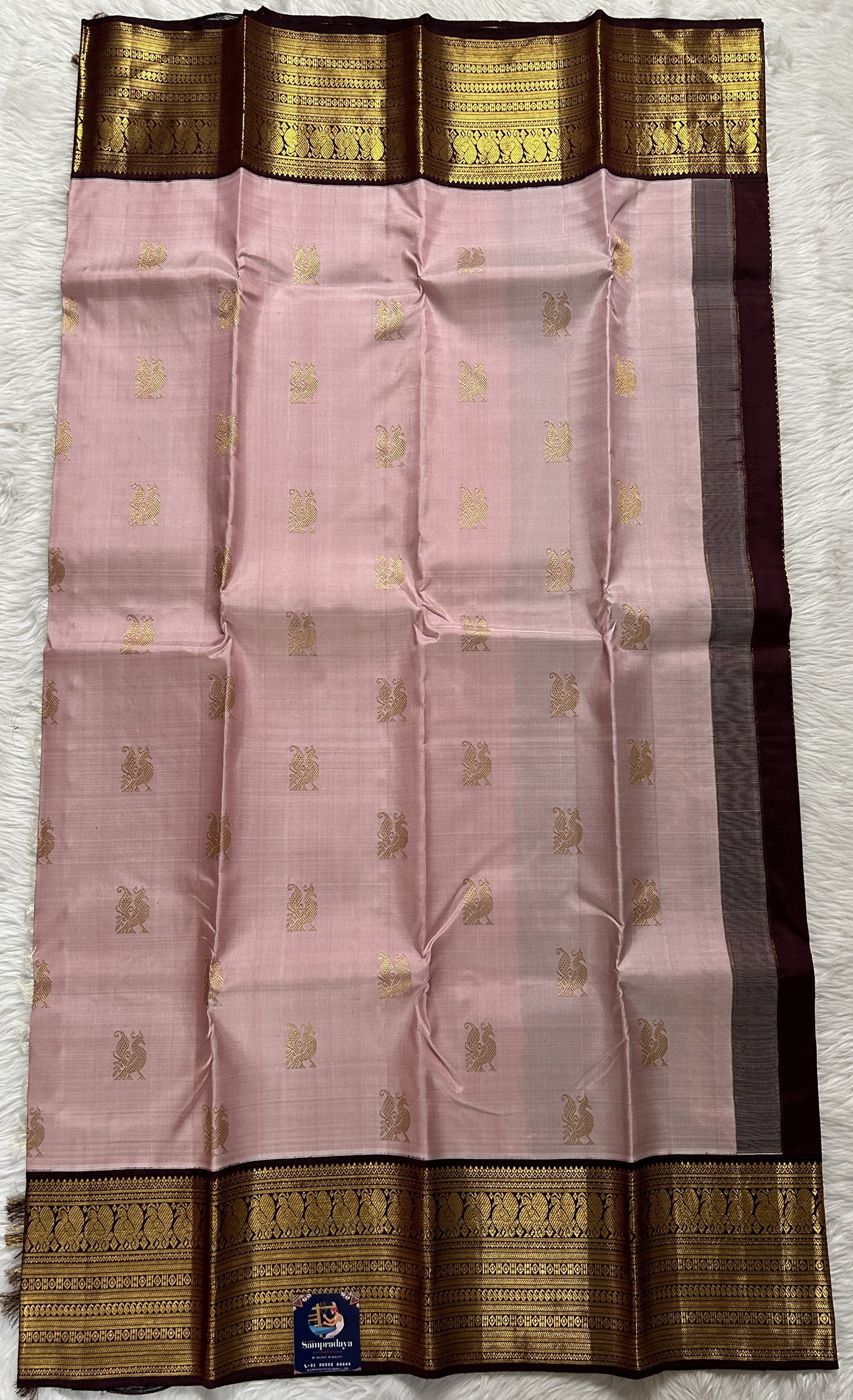 Kanjivaram Festive Silk Saree Pastel Pink colored Saree complemented with a Brown Colored Gold Kanchi border. - Sampradaya Designer Studio