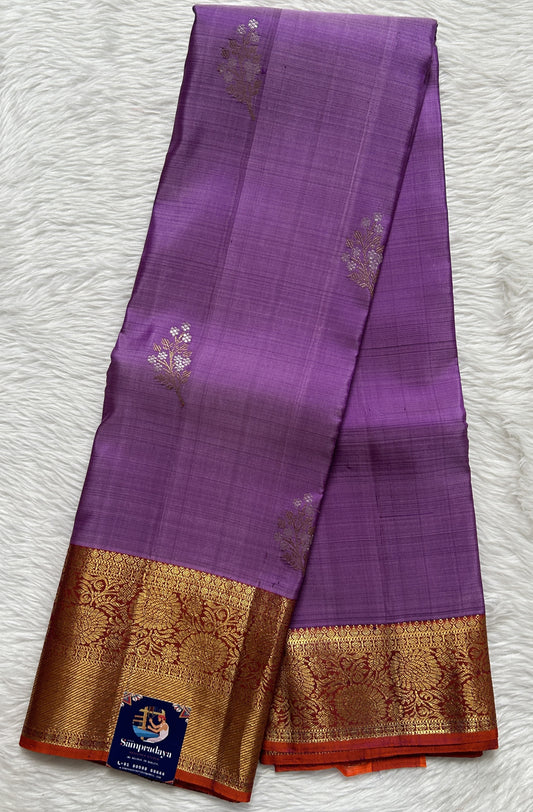 Kanjivaram Festive Silk Saree Lavender colored Saree complemented with a Red Orange Colored Gold Kanchi border. - Sampradaya Designer Studio