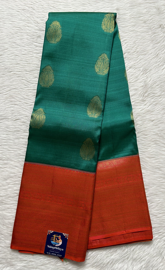 Kanjivaram Festive Silk Saree Persian Green colored Saree complemented with a Red Colored Gold Kanchi border. - Sampradaya Designer Studio