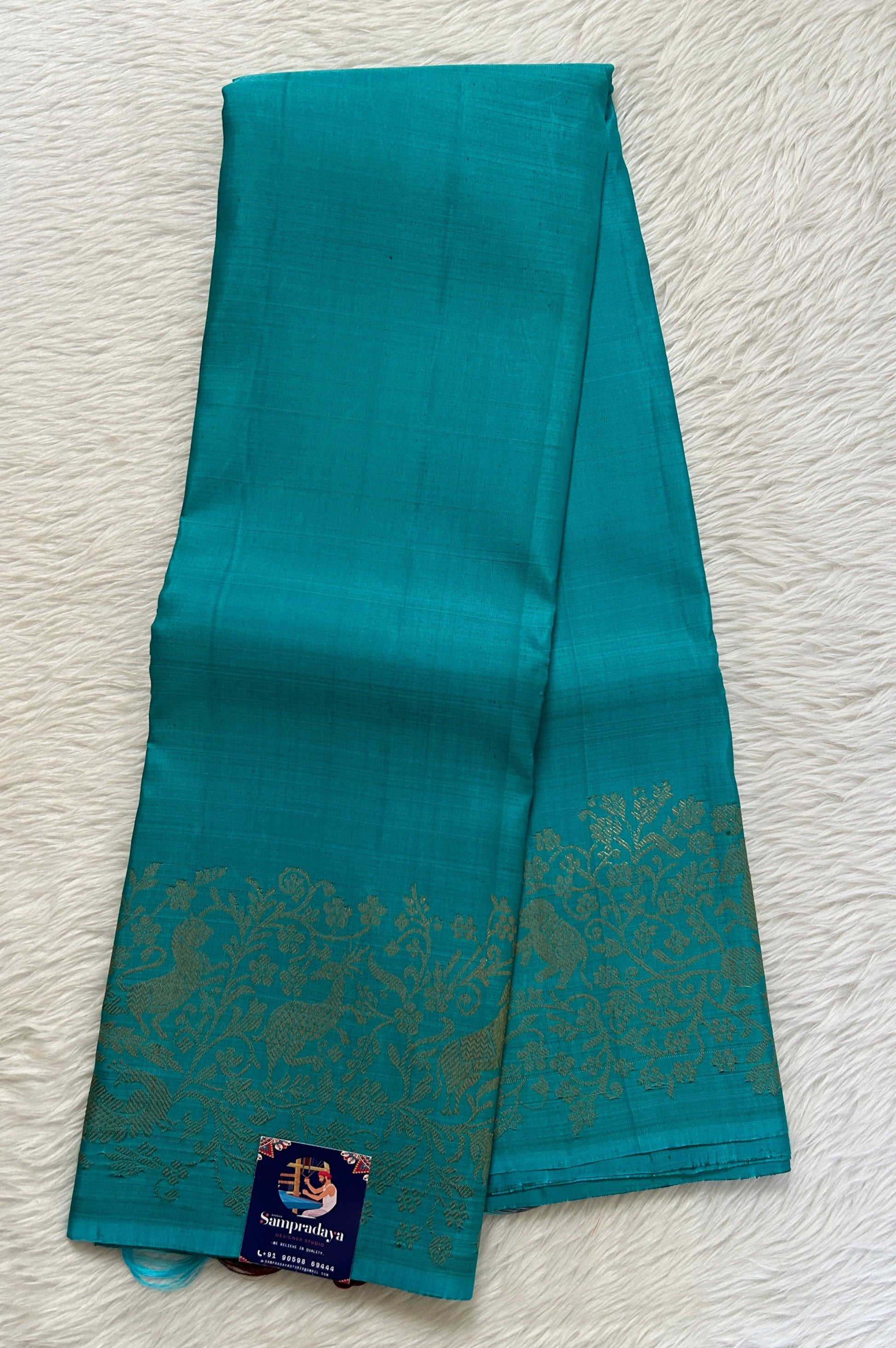 Kanjivaram Festive Silk Saree Turquoise Blue colored Saree complemented with a Gold Zari border. - Sampradaya Designer Studio