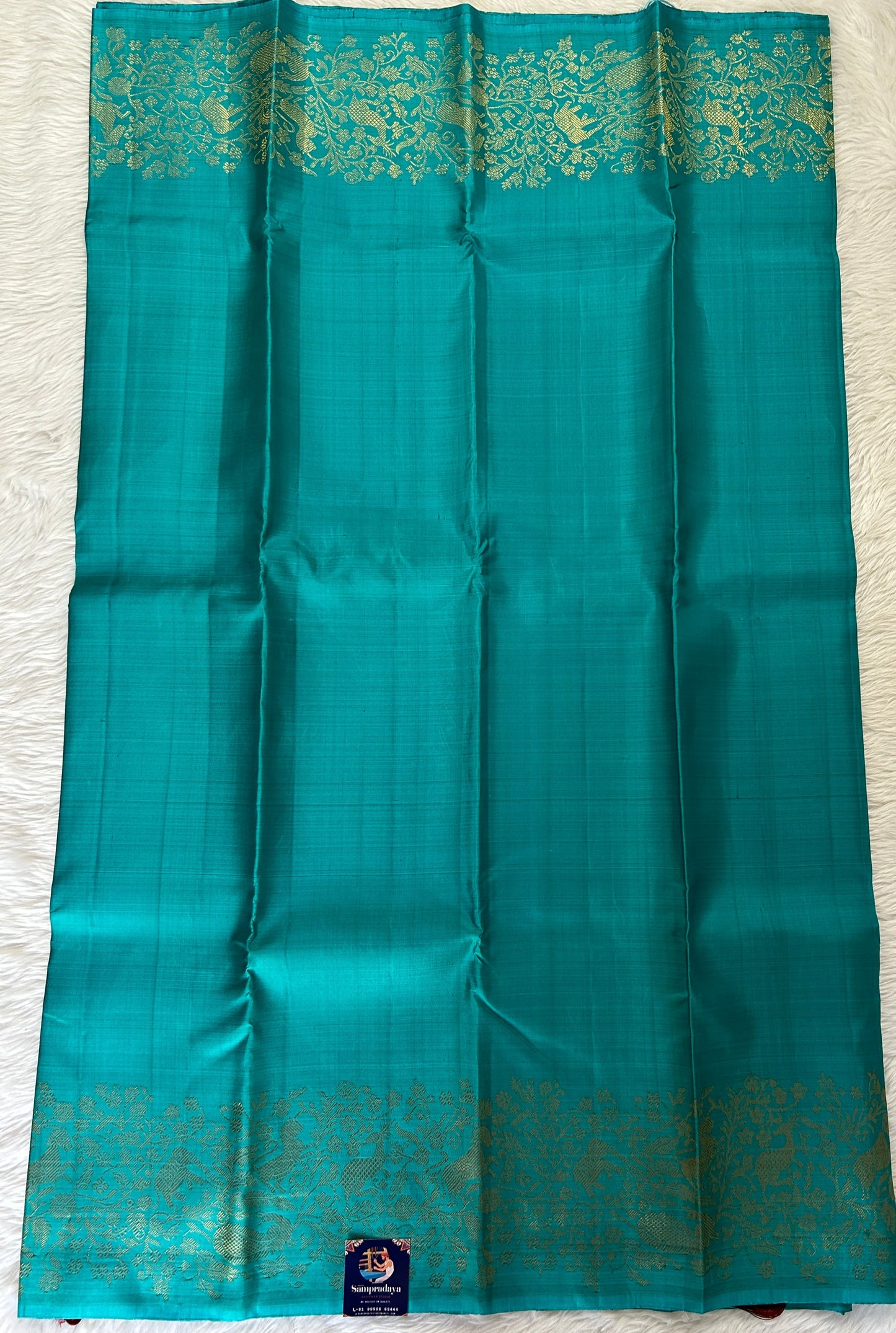 Kanjivaram Festive Silk Saree Turquoise Blue colored Saree complemented with a Gold Zari border. - Sampradaya Designer Studio