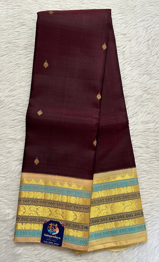 Kanjivaram Festive Silk Saree Brown colored Saree complemented with a Cream Colored Kanchi border. - Sampradaya Designer Studio