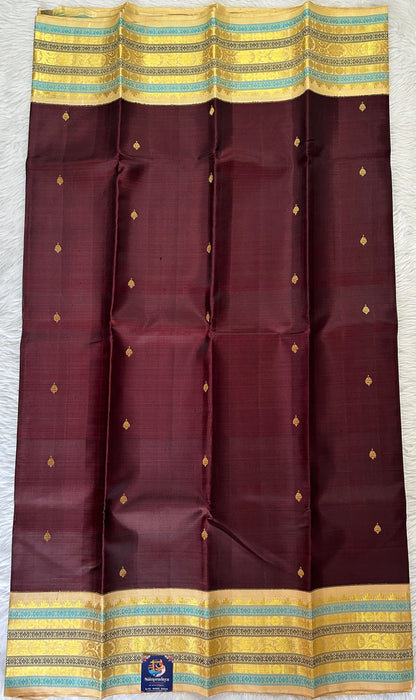 Kanjivaram Festive Silk Saree Brown colored Saree complemented with a Cream Colored Kanchi border. - Sampradaya Designer Studio