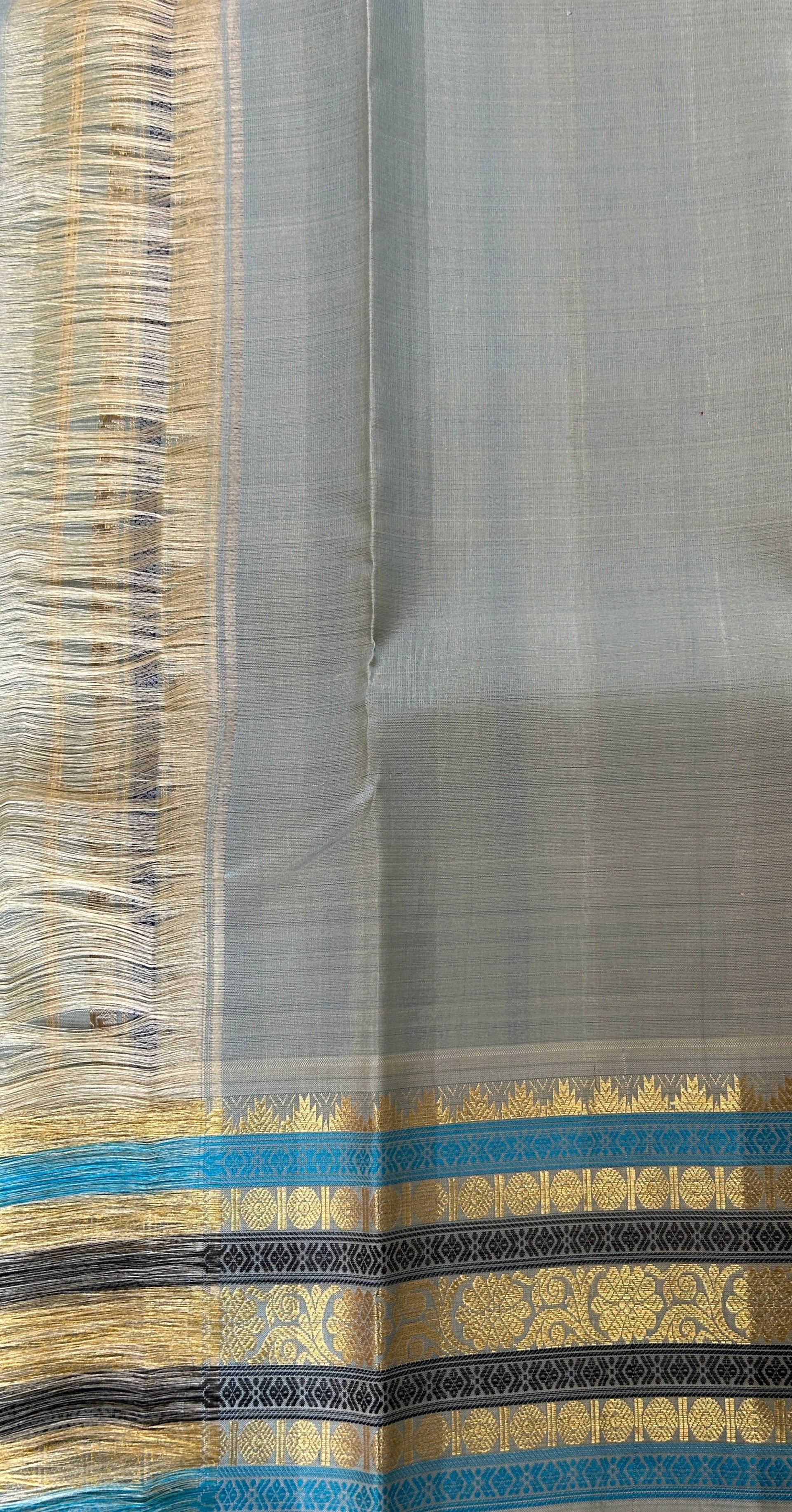 Kanjivaram Festive Silk Saree Orange colored Saree complemented with a Pastel Blue Colored Kanchi border. - Sampradaya Designer Studio