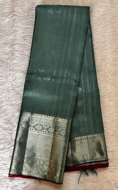 Kanjivaram Festive Silk Saree Rama Green colored Saree complemented with a Silver Kanchi border. - Sampradaya Designer Studio