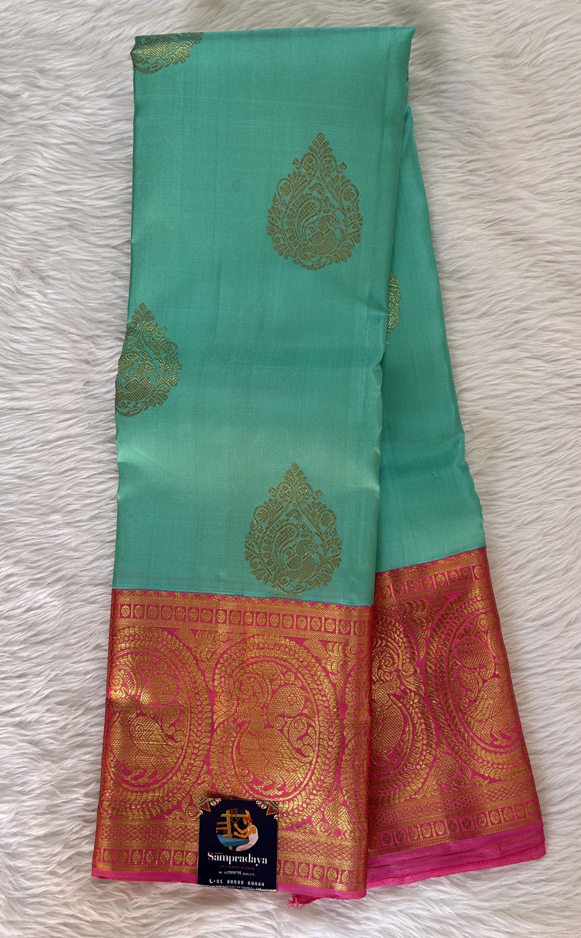 Kanjivaram Festive Silk Saree Sea Green colored Saree complemented with a Baby Pink Colored Kanchi border. - Sampradaya Designer Studio