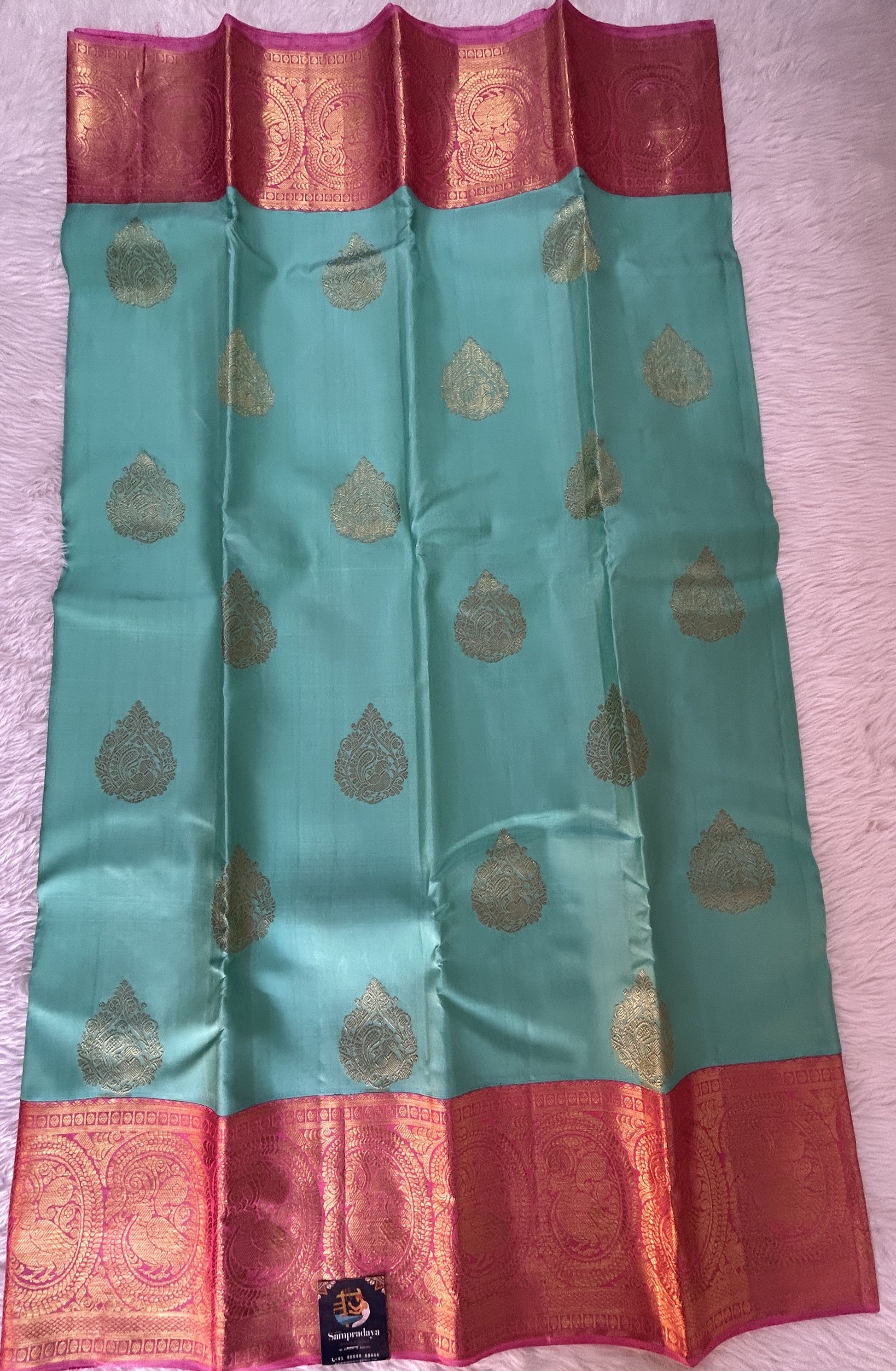 Kanjivaram Festive Silk Saree Sea Green colored Saree complemented with a Baby Pink Colored Kanchi border. - Sampradaya Designer Studio