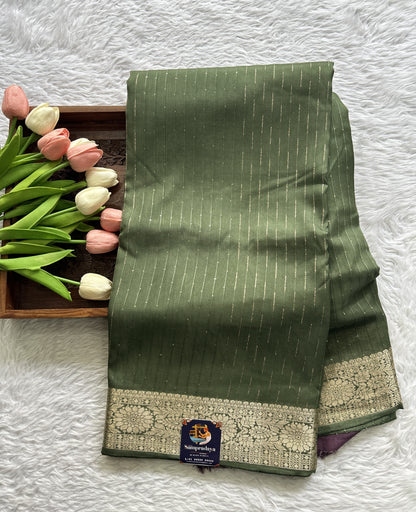 Semi Georgette Saree Green Colored Complemented with a Zari Border. - Sampradaya Designer Studio