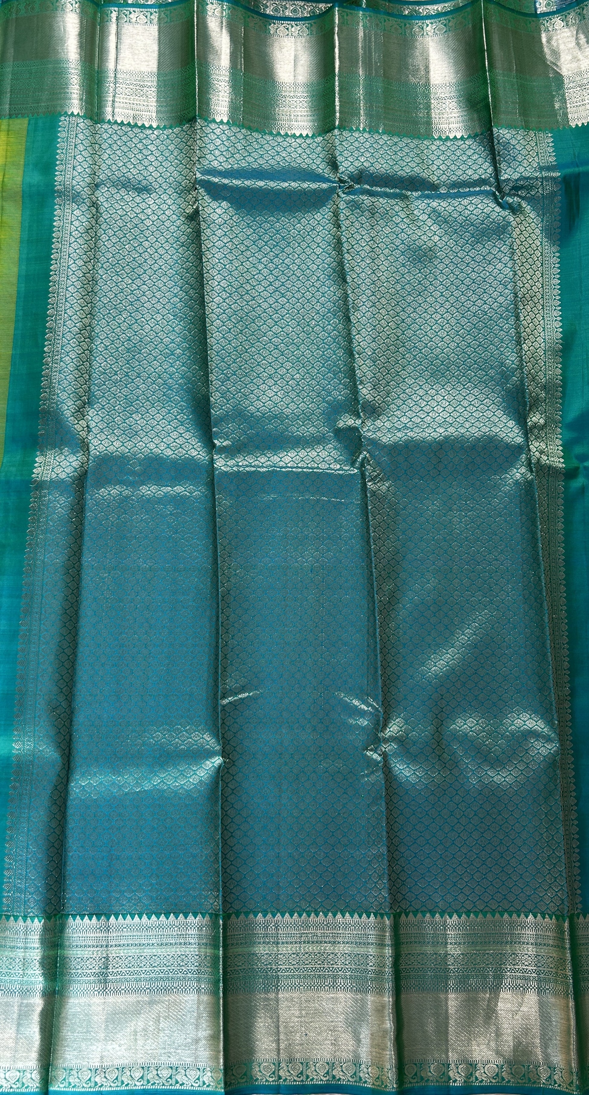 Kanjivaram Festive Silk Saree Green colored Saree complemented with a Blue Kanchi border. - Sampradaya Designer Studio